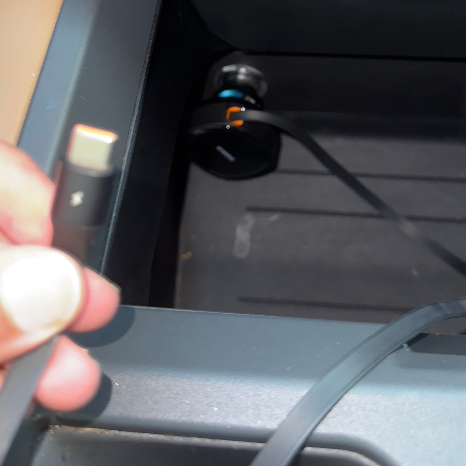 Retractable USB-C cable extended from a dual USB-C car charger