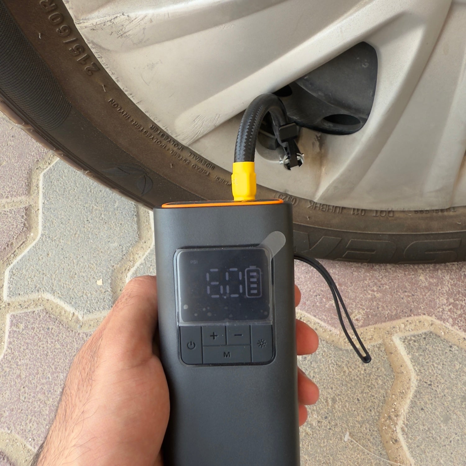 Portable air compressor showing tire pressure on the digital display